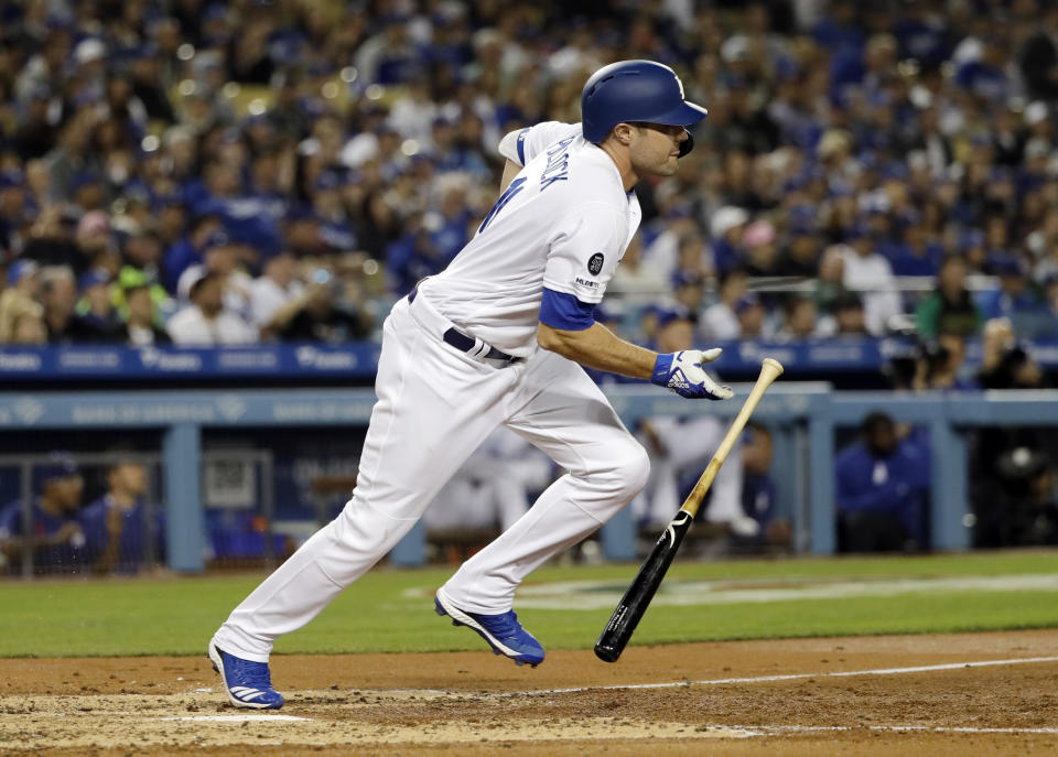 Los Angeles Dodgers' A.J. Pollock follows through on a bases-loaded two-RBI single against the Arizona Diamondbacks during the third inning of a baseball game Friday, March 29, 2019, in Los Angeles. (AP Photo/Marcio Jose Sanchez)