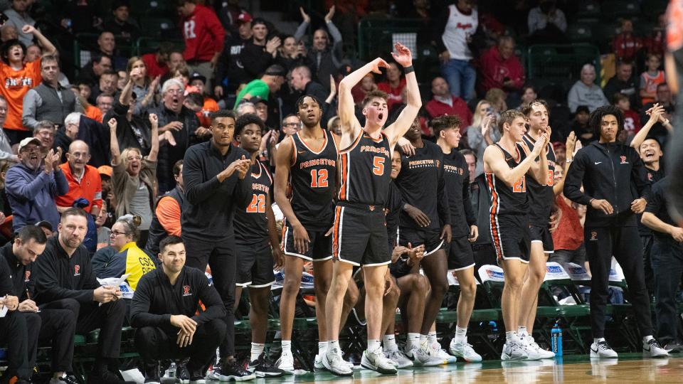 Members of the Princeton men's basketball team and their fans celebrate after Princeton defeated Rutgers, 68-61, in the college men's basketball game played at the Cure Insurance Arena in Trenton on Monday, November 6, 2023.