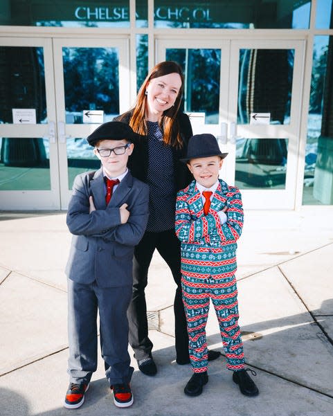 Lincoln Bolitho and James Ramage with their school principal Allison Hernandez. The trio dressed up for 'Dapper Day' at Chelsea Elementary School.