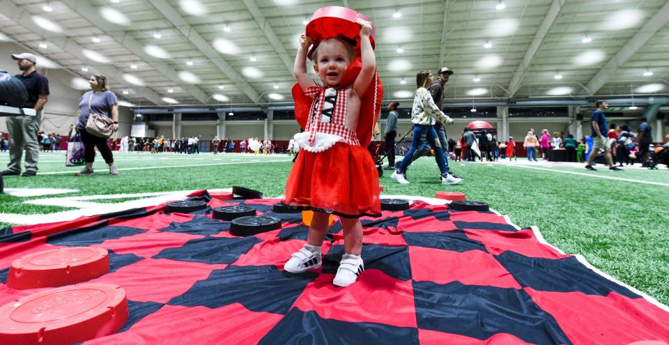 Oct 31, 2022; Tuscaloosa, AL, USA; The University of Alabama athletics department sponsored a night of Halloween fun with student athletes Monday night in the Hank Crisp Indoor Practice Facility. Leighton Gillott plays on a giant checker board. 