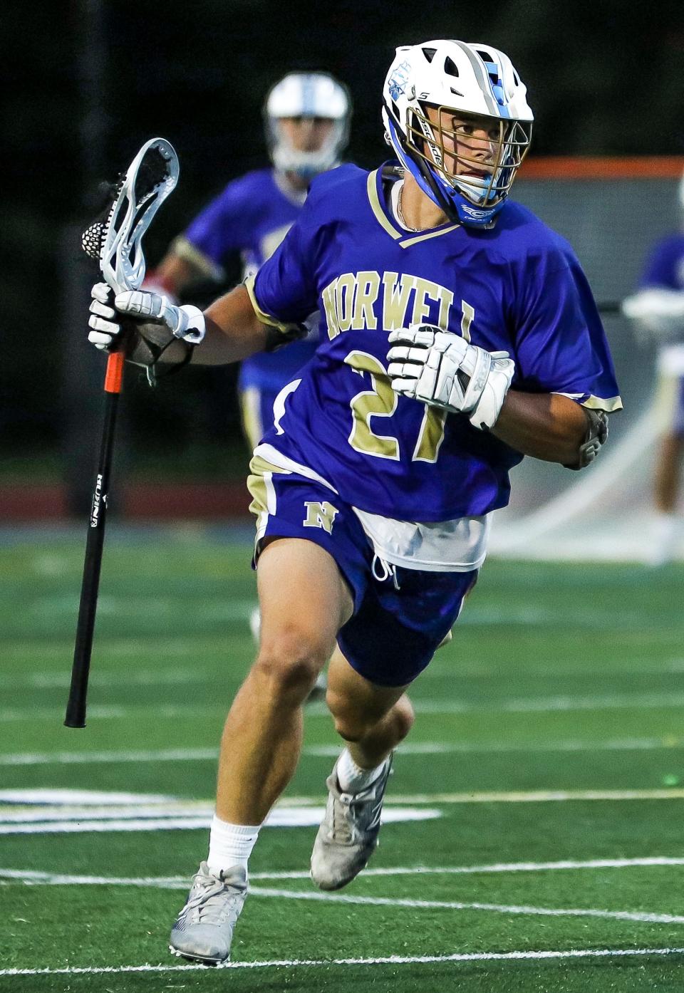 Norwell's John Mullen carries the ball during the Division 3 state title game against Medfield on the campus of Worcester State University on Wednesday, June 22, 2022.