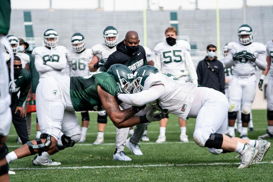 New Michigan State coach Mel Tucker (middle) watches offensive lineman Spencer Brown (left) and defensive tackle Maverick Hansen battle during a drill at Spartan Stadium last month. On Saturday, the Spartans will open the 2020 season against Rutgers.