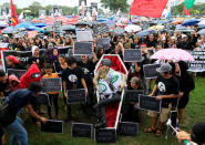 Protesters gather around an effigy of late dictator Ferdinand Marcos inside a mock coffin during a protest at Luneta park, metro Manila, Philippines November 25, 2016, denouncing his burial inside the Libingan ng mga Bayani (Heroes' cemetery) last week. REUTERS/Romeo Ranoco