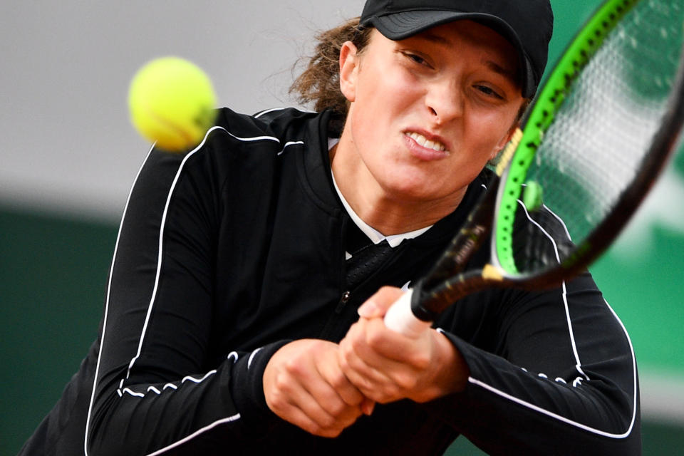 Poland's Iga Swiatek eyes the ball as she plays a backhand return to France's Selena Janicijevic during their women's singles first round match on day three of The Roland Garros 2019 French Open tennis tournament in Paris on May 28, 2019. (Photo by Martin Bureau/AFP/Getty Images)