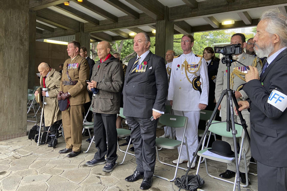 Richard Day, far left, a British army veteran who survived the Burma Campaign, and relatives of other veterans attend a memorial at the Chidorigafuchi National Cemetery in Tokyo, Monday, Oct. 9, 2023. The memorial was attended by military officials from the embassies of several former allied nations, including Australia, Britain, New Zealand and the U.S. at the cemetery for the unknown Japanese who died overseas during the war. (AP Photo/Mari Yamaguchi)