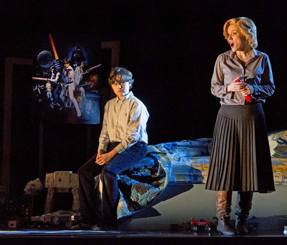 In this Feb. 22, 2013 photo provided by the New York City Opera, Benjamin P. Wenzelberg in the role of Miles and Sara Jakubiak as the Governess perform during a dress rehearsal of “The Turn of the Screw,” by the New York City Opera at the Brooklyn Academy of Music in New York. (AP Photo/New York City Opera, Richard Termine)