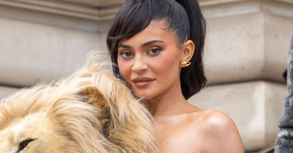 Kylie Jenner at Paris Fashion Week wearing a lion head