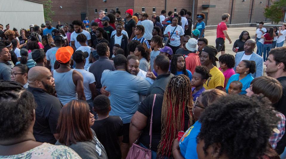 Tyrese Hoskin's father Tayrl Hoskin, center, was overwhelmed by the support and comfort shown to him and his family during a vigil at Germantown High School in Madison, Miss., Tuesday evening, August 2, 2022.. Tyrese Hoskin, 17, a student at Germantown High, and Armond Littleton, 15, a student at Madison-Central, died early Monday morning in a single-vehicle accident in Madison County.