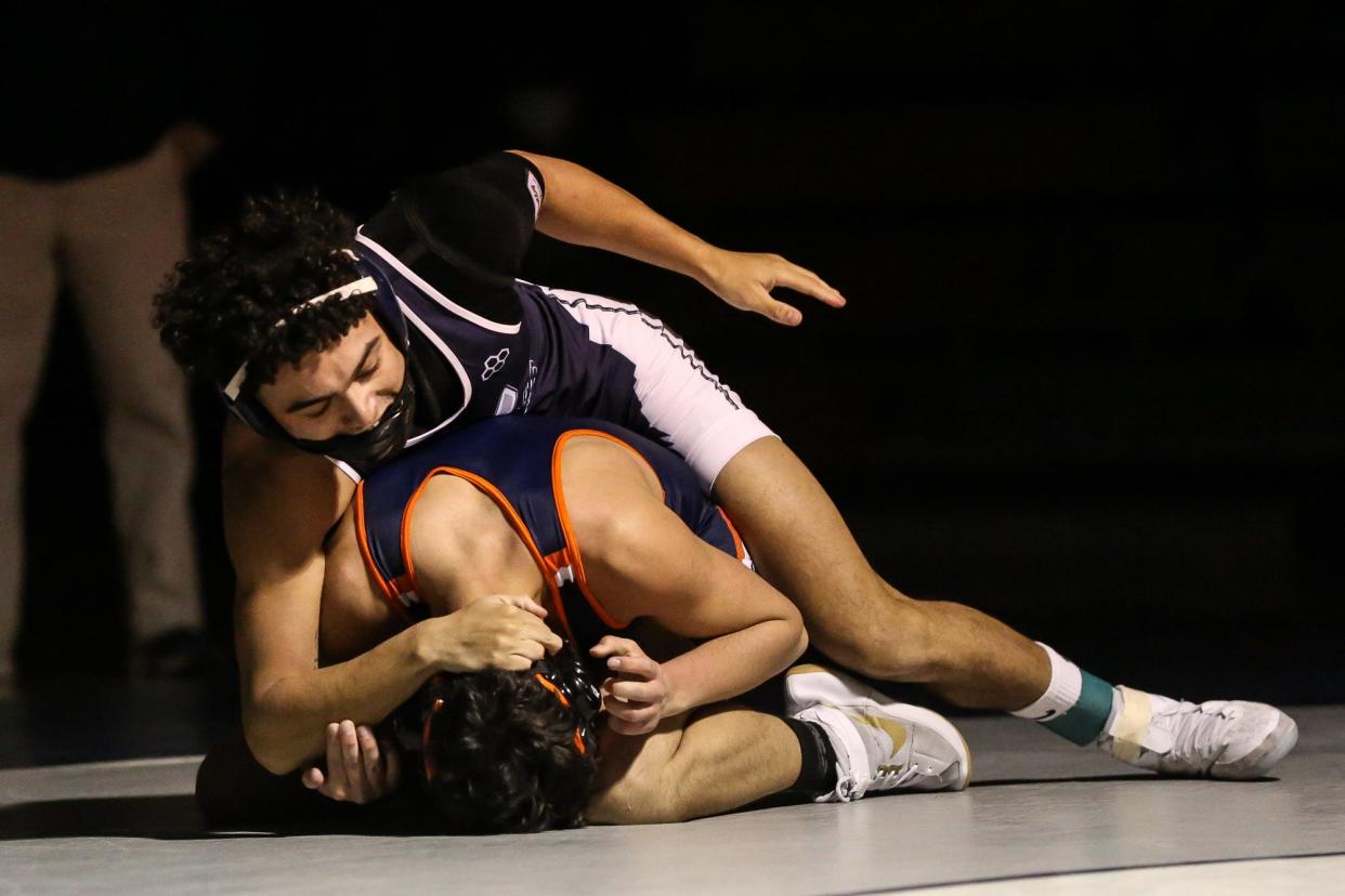 Framingham’s Marcus O’Brien wrestles in the 138-pound class during the wrestling match against Walpole at Framingham High School on Jan. 5, 2022.