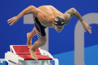 Caeleb Dressel, of United States, starts the men's 50-meter freestyle final at the 2020 Summer Olympics, Sunday, Aug. 1, 2021, in Tokyo, Japan. (AP Photo/David Goldman)