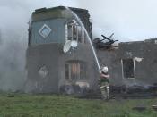 A firefighter works near a psychiatric hospital destroyed by fire in the Novgorod region town of Luka is seen in this September 13, 2013 handout provided by the Russian Emergencies Ministry. The fire raged through the Russian psychiatric hospital on Friday, killing at least one person and leaving dozens missing as police searched the surrounding area for survivors, emergency and law enforcement officials said. Picture taken with a video camera. (REUTERS/Russian Emergencies Ministry of Novgorod region/Handout via Reuters)