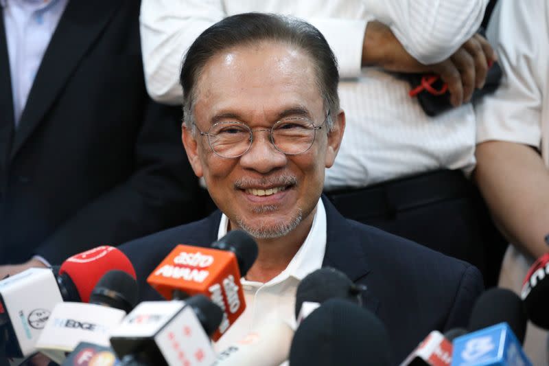Malaysian politician Anwar Ibrahim smiles during a news conference in Petaling Jaya