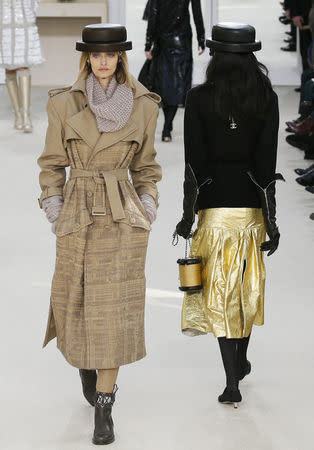 Models present creations by German designer Karl Lagerfeld as part of his Fall/Winter 2016/2017 women's ready-to-wear collection for fashion house Chanel at the Grand Palais in Paris, France, March 8, 2016. REUTERS/Gonzalo Fuentes