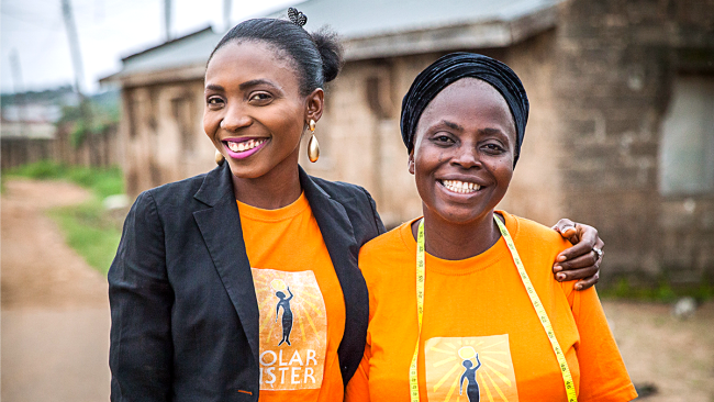 L to R: Solar Sister Business Development Associate, Omotola Ajao, and Solar Sister clean energy entrepreneur, Rachel Joke Olakanye. Photo credit: Solar Sister, Fid Thompson