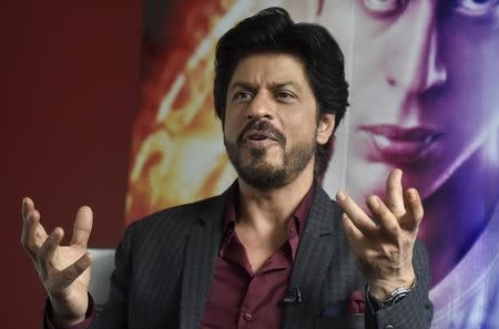 Bollywood actor Shah Rukh Khan speaks during an interview with Reuters at Madame Tussauds in London, Britain April 13, 2016. REUTERS/Hannah McKay