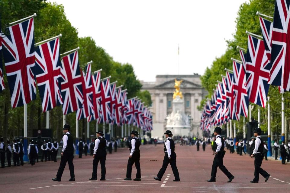 September 19, 2022, London, UK: File photo dated 14/09/22 of police officers in The Mall in central London. The day of the Queen's funeral marks the climax of what is being regarded as the biggest security operation the UK has ever seen. Huge crowds, royalty and a long list of world leaders as well as other dignitaries will all need to be kept safe as part of the mammoth job facing thousands of police officers. (Credit Image: © Victoria Jones/PA Wire via ZUMA Press)