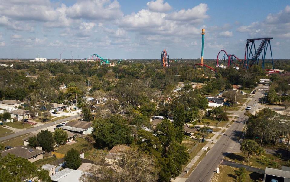 A view of the street with roller coasters at Busch Gardens visible in the background in a Tampa neighborhood where many rental homes are owned by a real estate investment fund whose top foreign investors are heirs of the French fashion company Hermès