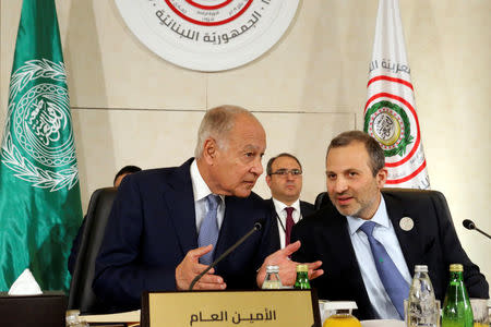 Arab League Secretary-General Ahmed Abul Gheit gestures as he talks with Lebanese Foreign Minister Gebran Bassil, at a pre Arab Economic and Social Development summit meeting in Beirut, Lebanon January 18, 2019. REUTERS/Mohamed Azakir