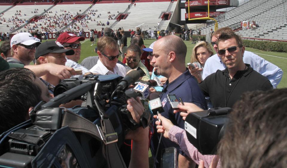 Houston Texan's coach Bill O'Brien fields questions from the media after watching South Carolina defensive end Jadeveon Clowney compete in a drill for NFL representatives at South Carolina football pro day in Columbia, S.C., Wednesday, April 2, 2014. (AP Photo/Mary Ann Chastain)