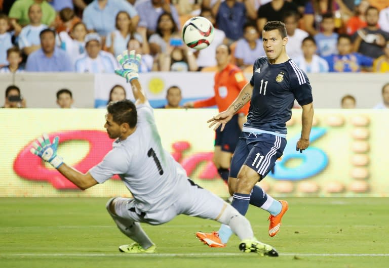 Sergio Aguero of Argentina scores a goal past Dainel Vaca of Bolivia during their international friendly match at BBVA Compass Stadium on September 4, 2015 in Houston, Texas