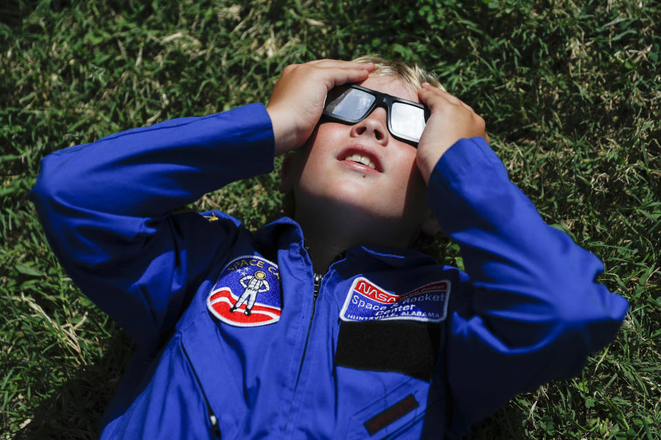 FILE - Tyler Hanson, of Fort Rucker, Ala., watches the sun moments before the total eclipse, Monday, Aug. 21, 2017, in Nashville, Tenn. The April 8, 2024 total solar eclipse in North America first hits land at Mexico’s Pacific coast, cuts diagonally across the U.S. from Texas to Maine and exits in eastern Canada. (AP Photo/John Minchillo)