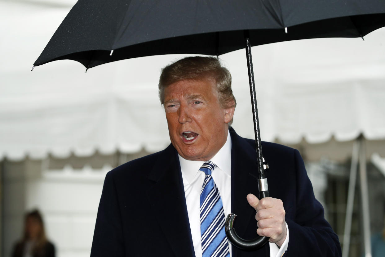 President Donald Trump speaks about the coronavirus as he walks to Marine One to depart the White House on Saturday. (Photo: ASSOCIATED PRESS)
