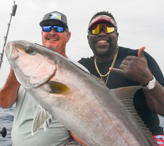 TCPalm columnist and outdoors reporter Ed Killer and NFL Hall of Famer Warren Sapp amberjack fishing in April 2021.