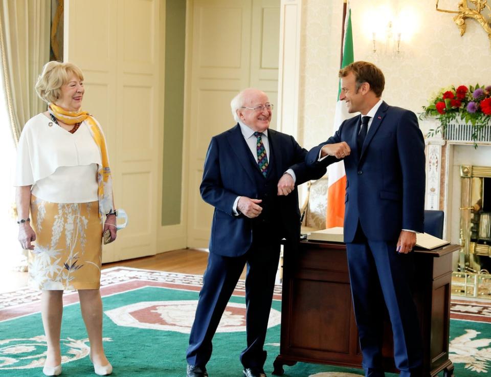 Michael D Higgins and Emmanuel Macron elbow-bumped as they met (Maxwells/PA) (PA Media)