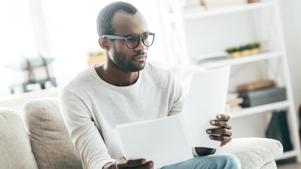 man reviewing paperwork