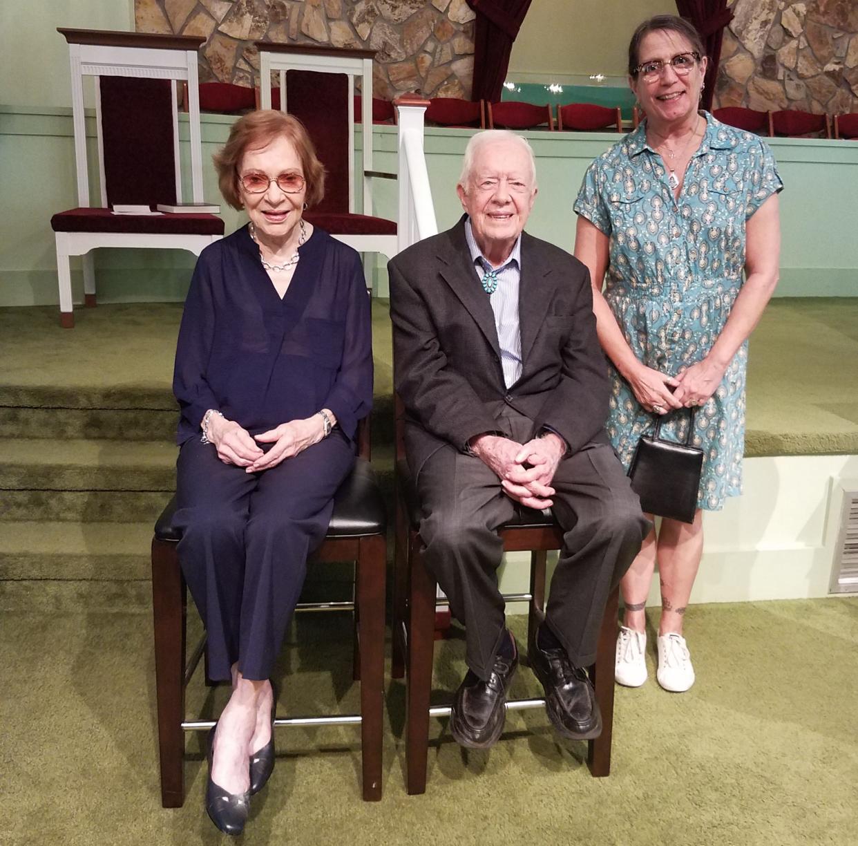 Kati Schardl stands with Rosalynn and Jimmy Carter following one of their Sunday Services in 2019.