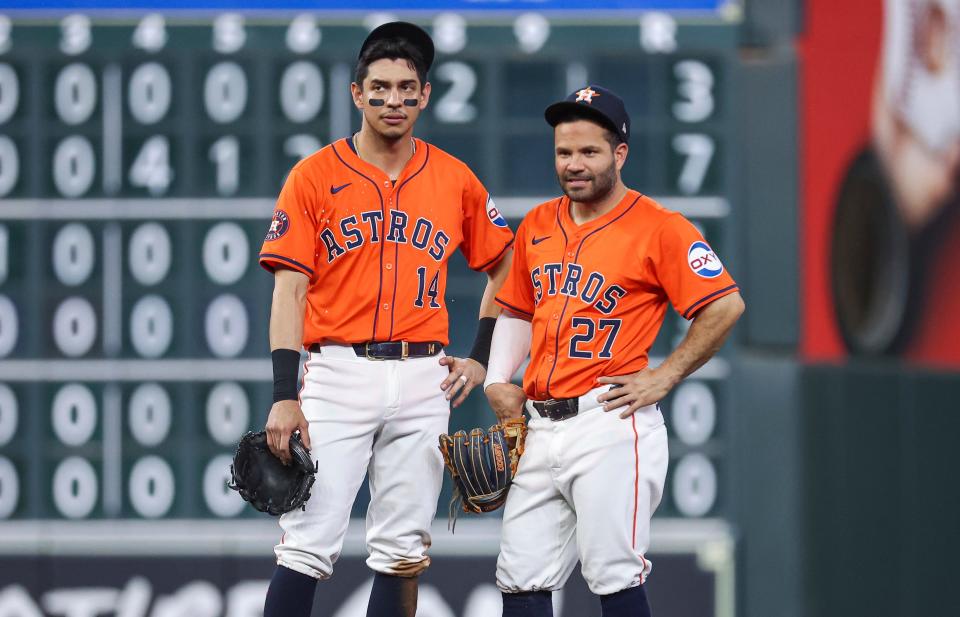 Houston Astros shortstop Mauricio Dubon (14) and second baseman Jose Altuve (27) look on during a game against the Minnesota Twins at Minute Maid Park on May 31, 2024.