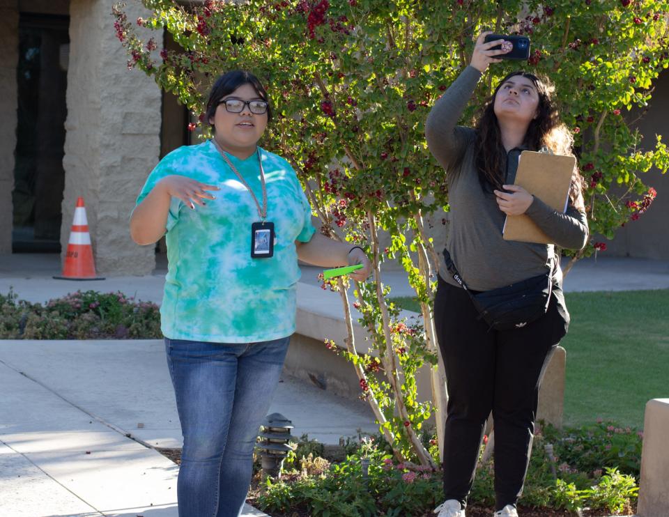 Rise Up 4 Abortion Rights organizer Oriana Perez (left) speaks to 20 protesters in front of Palm Desert City Hall in Palm Desert, Calif., on July 1, 2022.
