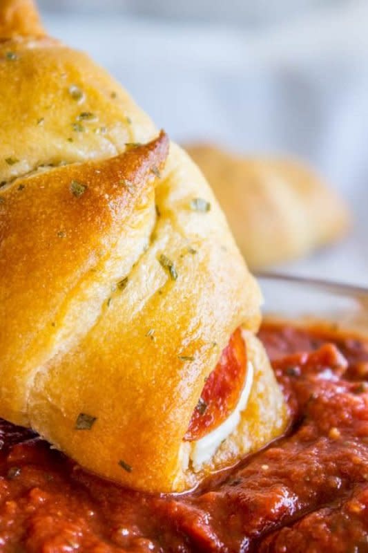 <p>The Food Charlatan</p><p>This is such an easy three-ingredient snack, back-to-school lunch or game-day appetizer! It’s a slab of cream cheese and some pepperoni rolled up in a crescent and baked.</p><p><strong>Get the recipe: <a href="https://thefoodcharlatan.com/pepperoni-cream-cheese-crescent-rolls-recipe/" rel="nofollow noopener" target="_blank" data-ylk="slk:Pepperoni Cream Cheese Crescent Rolls;elm:context_link;itc:0;sec:content-canvas" class="link ">Pepperoni Cream Cheese Crescent Rolls</a></strong></p>