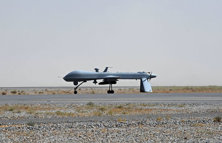 An unmanned US Predator drone armed with a missile stands on the tarmac of Kandahar military airport on June 13, 2010. A newly revealed Justice Department memo finds that US citizens believed to be senior Al-Qaeda operators may lawfully be killed, even if no intelligence shows they are actively plotting an attack