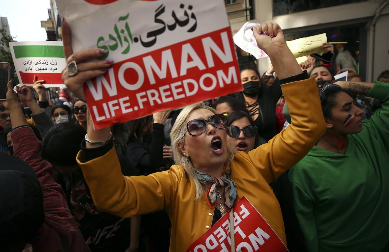 Iranian women protesting the death of Mahsa Amini gather outside the Iranian consulate in Istanbul, Turkey on Oct. 17, 2022. (AP Photo/Emrah Gurel)