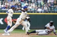 May 20, 2018; Seattle, WA, USA; Seattle Mariners shortstop Jean Segura (2) turns a double play against Detroit Tigers shortstop Dixon Machado (49) during the tenth inning at Safeco Field. Mandatory Credit: Joe Nicholson-USA TODAY Sports