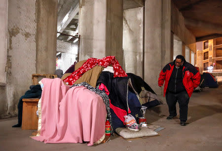 Richard S. Vargas, The Salvation Army Director of Community Social Services, checks on homeless Blanca Rodriguez for cold wellness checkup in Chicago, Illinois, U.S., January 31, 2019. REUTERS/Kamil Krzaczynski