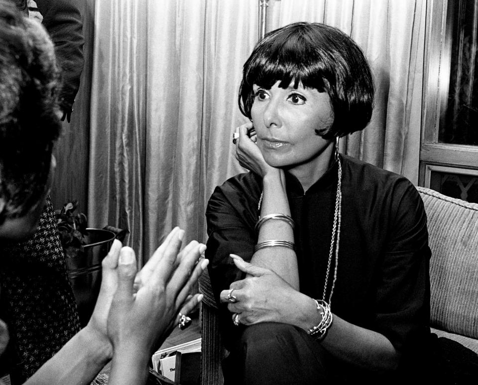 Lena Horne talks with a friend during a cocktail party in her honor at Fisk University in Nashville in 1973.