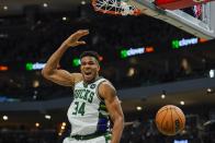 Milwaukee Bucks' Giannis Antetokounmpo dunks during the second half of an NBA basketball game against the Charlotte Hornets Wednesday, Dec. 1, 2021, in Milwaukee. The Bucks won 127-125. (AP Photo/Morry Gash)