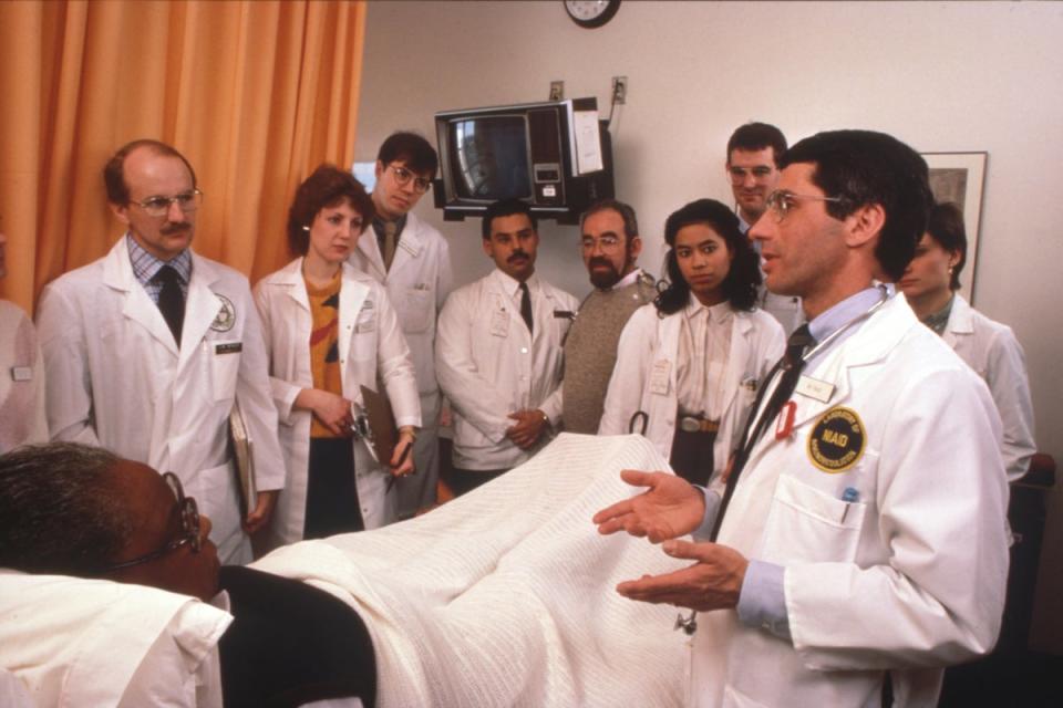 Dr Fauci and treatment team with an early Aids patient at NIH during medical rounds, circa 1986 (NIAID)