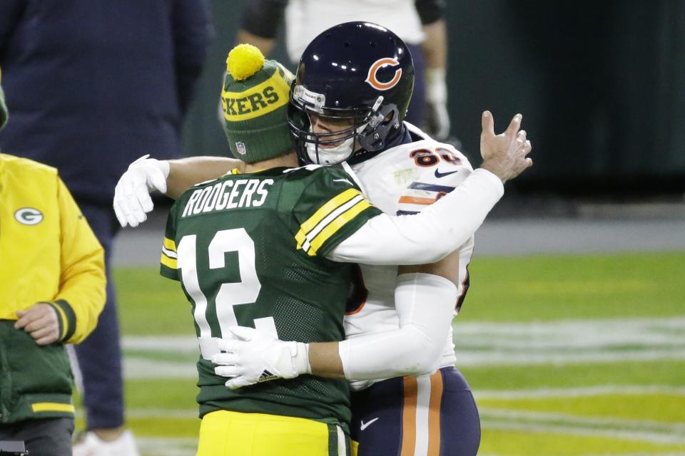 Green Bay Packers' Aaron Rodgers hugs Chicago Bears' Jimmy Graham after an NFL football game against the Chicago Bears Sunday, Nov. 29, 2020, in Green Bay, Wis. The Packers won 41-25. (AP Photo/Mike Roemer)