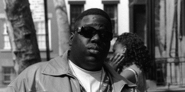 American rapper Biggie Smalls (also known as the Notorious B.I.G., born Christopher Wallace, 1972 - 1997) holds a bottle of St. Ides malt liquor, New York, New York, 1995. (Photo by Adger Cowans/Getty Images) (Photo: )