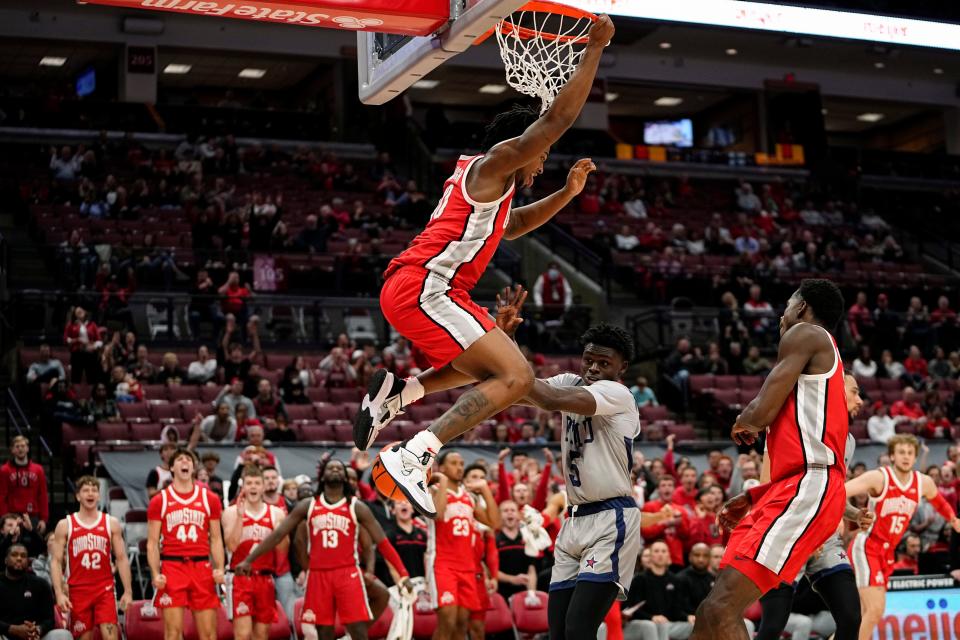 Nov 7, 2022; Columbus, Ohio, USA;  Ohio State Buckeyes guard Brice Sensabaugh (10) dunks over Robert Morris Colonials guard Enoch Cheeks (5) during the second half of the NCAA men's basketball game at Value City Arena. Ohio State won 91-53. Mandatory Credit: Adam Cairns-The Columbus Dispatch