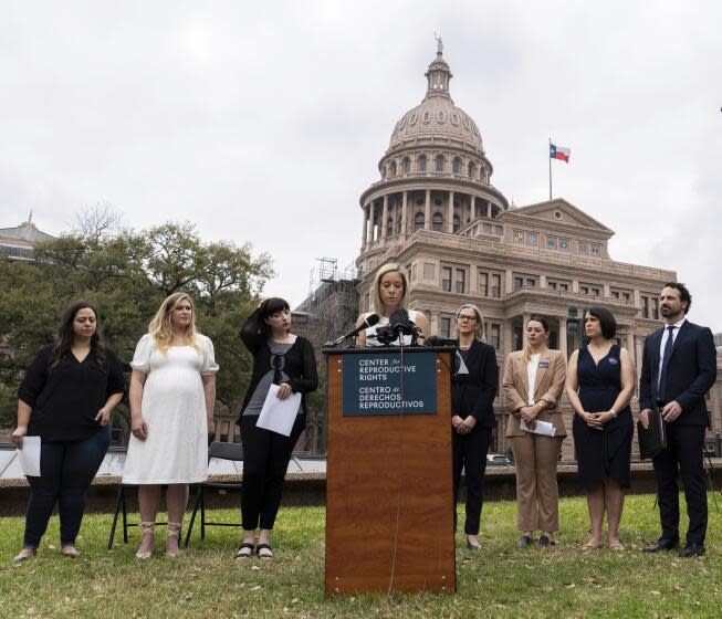 FILE - Amanda Zurawski, one of five plaintiffs, speaks in front of the state Capitol in Austin, Texas, March 7, 2023, as the Center for Reproductive Rights and the plaintiffs announced their lawsuit, which asks for clarity in Texas law as to when abortions can be provided under the "medical emergency" exception. All five women were denied medical care while experiencing pregnancy complications that threatened their health and lives. The women are headed to court Wednesday, July 19, as legal challenges to abortion bans across the U.S. continue a year after the fall of Roe v. Wade. (Sara Diggins/Austin American-Statesman via AP, File)