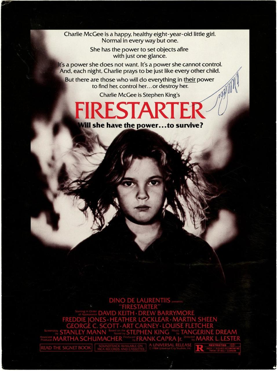 A promotional poster signed by producer Dino De Laurentiis for the feature film “Firestarter,” which shot in Wilmington in 1983.