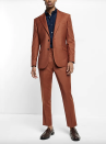 <p><strong>Express</strong></p><p>express.com</p><p><strong>$148.00</strong></p><p>Instead of choosing grey or navy as your alternative option to a black suit, go for a warm shade of rust like this slim-cut suit that boasts an elastic (yes, elastic!) waist. </p>