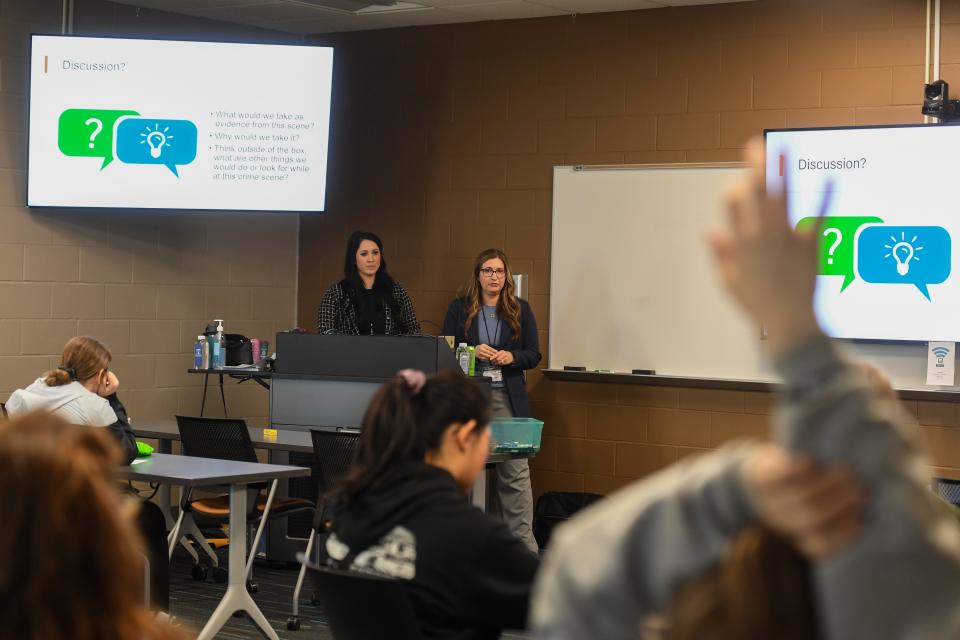 Sioux Falls detectives Melina Mitchell and Morgan Black discuss a hypothetical crime scene on Wednesday, March 6, 2024 inside The Hub at Southeast Technical College in Sioux Falls.