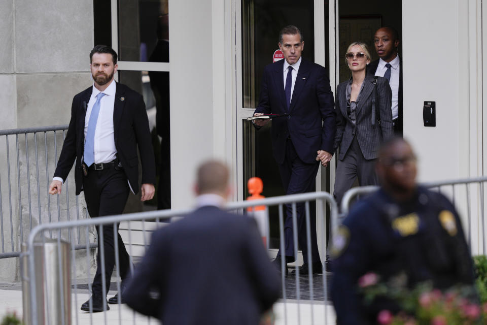 Hunter Biden, second from left, accompanied by his wife, Melissa Cohen Biden, depart from federal court, Monday, June 3, 2024, in Wilmington, Del. (AP Photo/Matt Rourke)