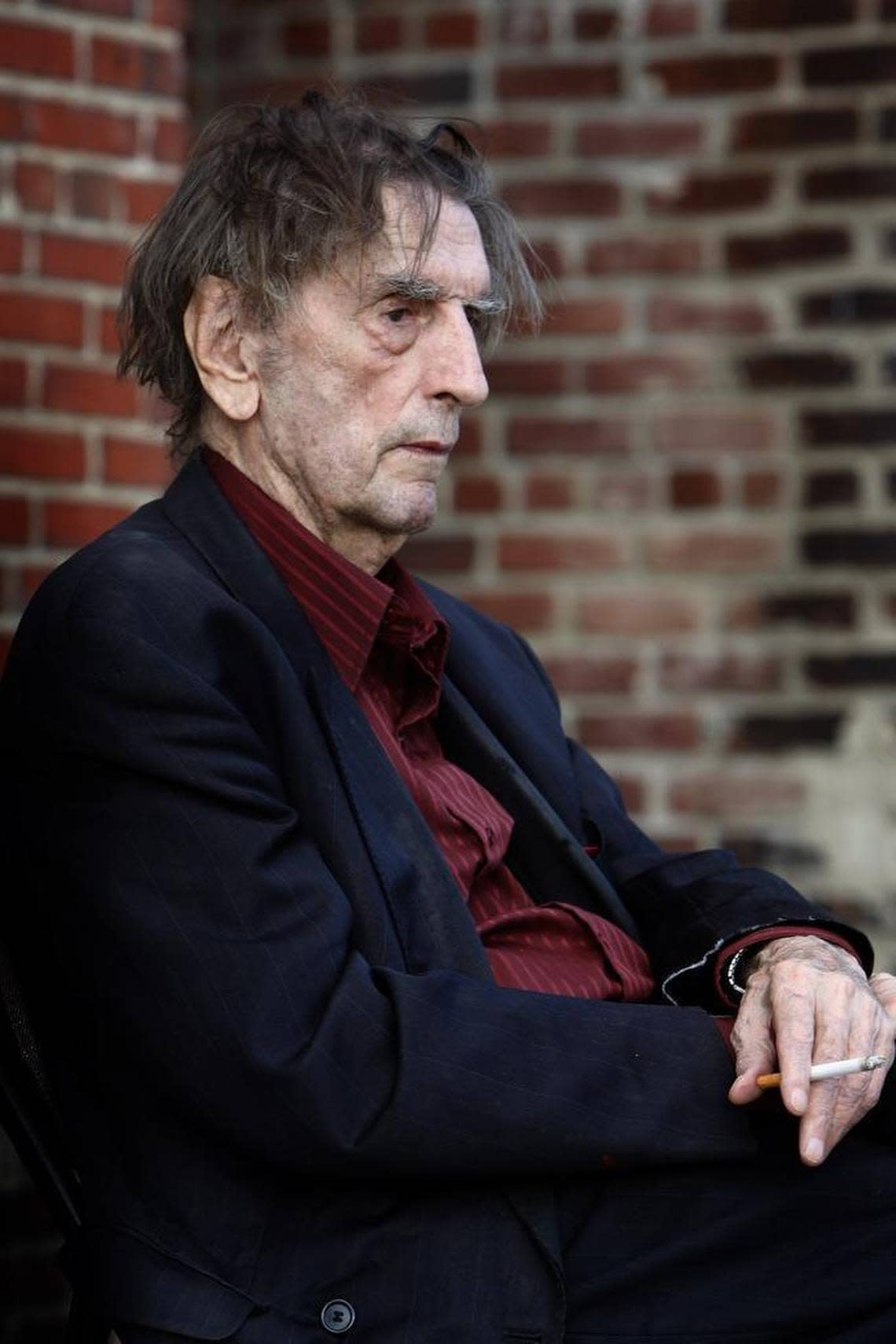 Harry Dean Stanton has a cigarette prior to a screening of “Dillinger” at the Kentucky Theatre in Lexington, Ky., June 15, 2014. The movie actor went to Lafayette High School and UK.