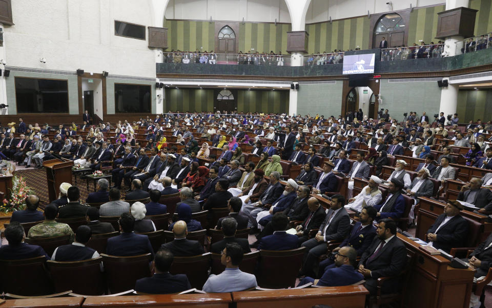 Afghan parliament members attend during the inauguration of the country's new parliament in Kabul, Afghanistan, Friday, April 26, 2019. President Ashraf Ghani has inaugurated the country's new parliament after almost six months since elections were held and following long delays, claims of voter fraud, unresolved disputes and political bickering. (AP Photo)